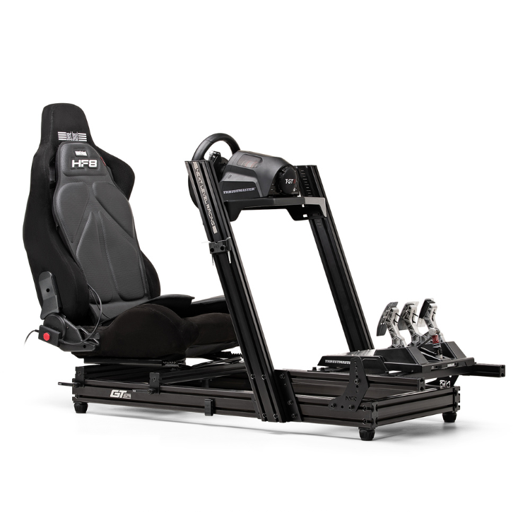 Next Level Racing HF8 gaming simulator, black seat and frame, with steering wheel and pedals.