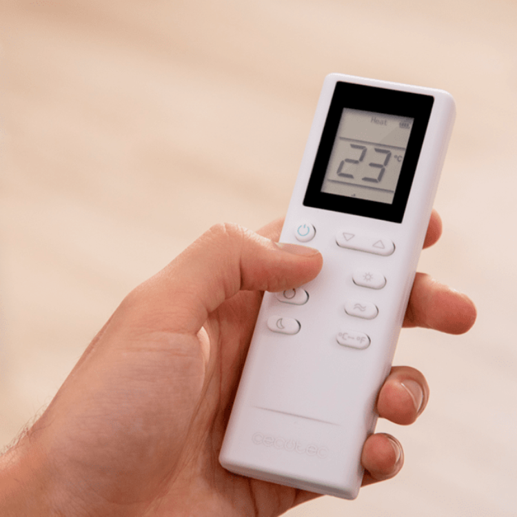 Cecotec portable air conditioner remote control, white, showing 23 degrees Celsius.