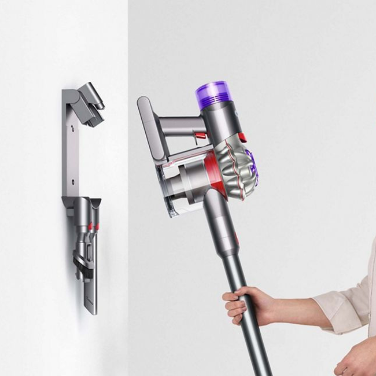 Dyson V8 silver and nickel upright vacuum with purple accents, wall mounted and handheld.