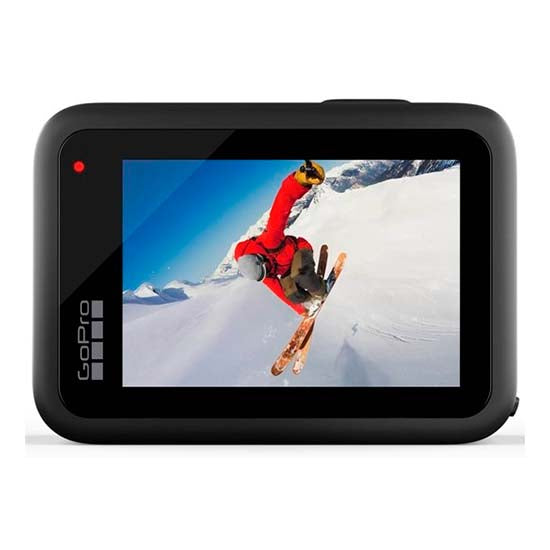 Black GoPro Hero 10 action camera displaying snowboarder in red snowsuit on screen.
