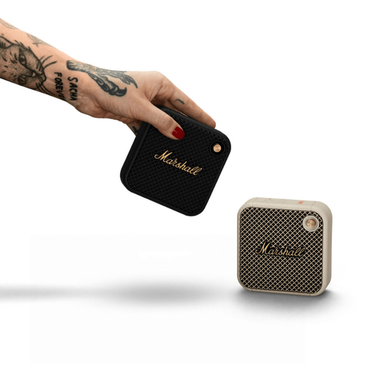 Marshall Willen cream and black portable Bluetooth speakers, compact and square-shaped.