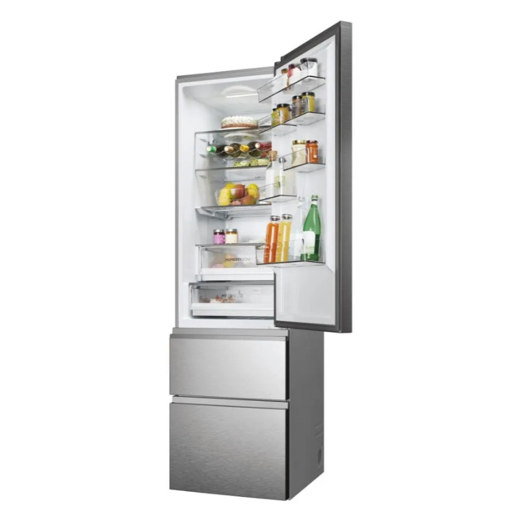 Haier HTW5620ENMG fridge with open freezer door, silver finish, 414L capacity, E class.