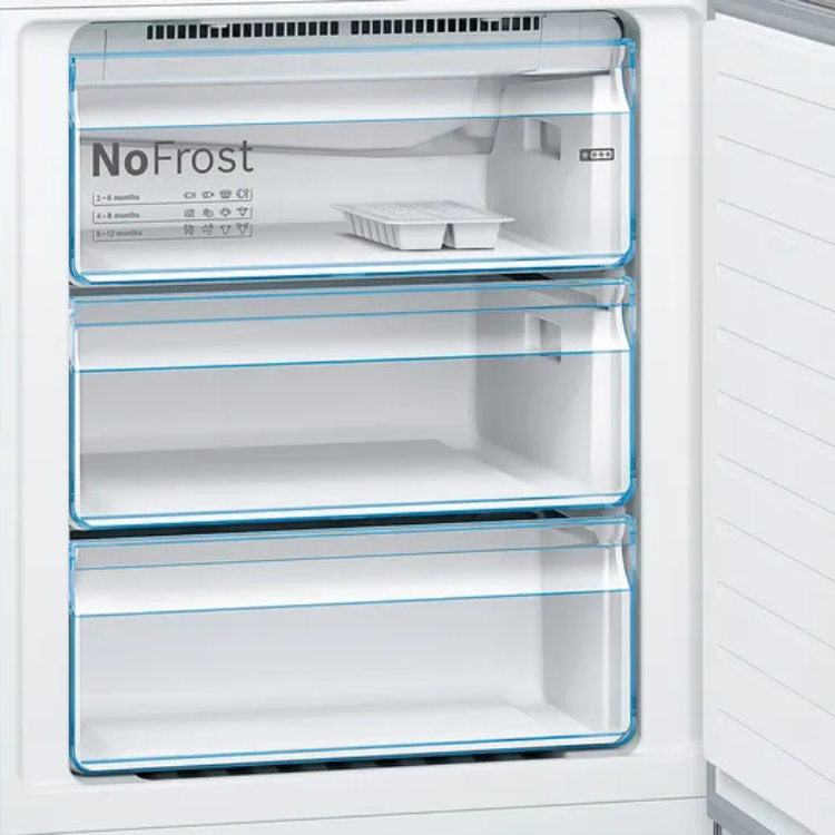 Bosch Serie 4 NoFrost fridge freezer interior, white, empty shelves.
