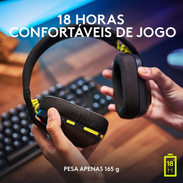 Black Logitech G435 Lightspeed wireless gaming headset with yellow accents, held by hands.