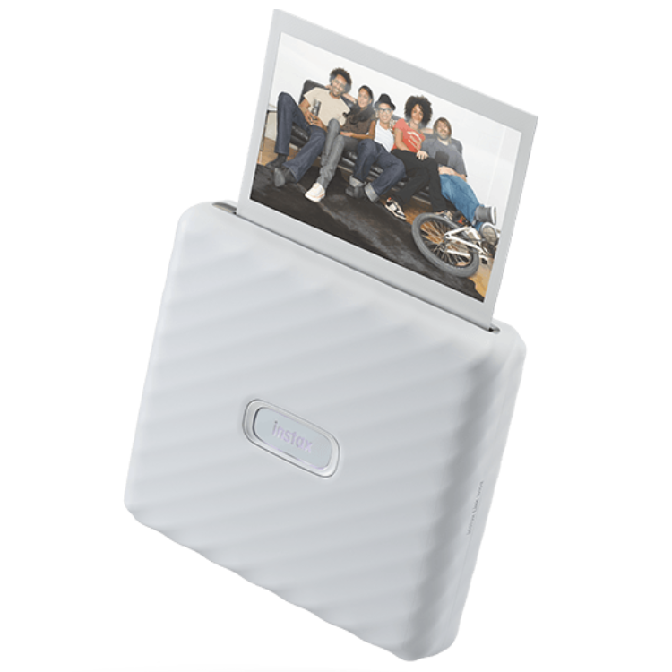 Fujifilm Instax Link Wide printer, white, printing photo of 6 people.