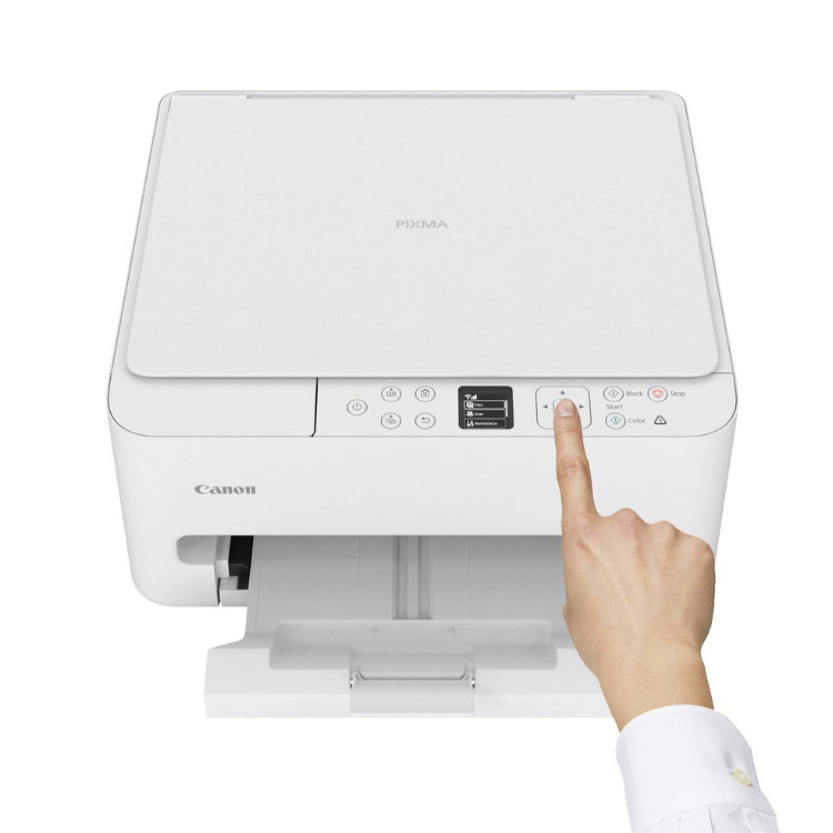 Canon PIXMA TS6550i white inkjet printer with hand pressing button.