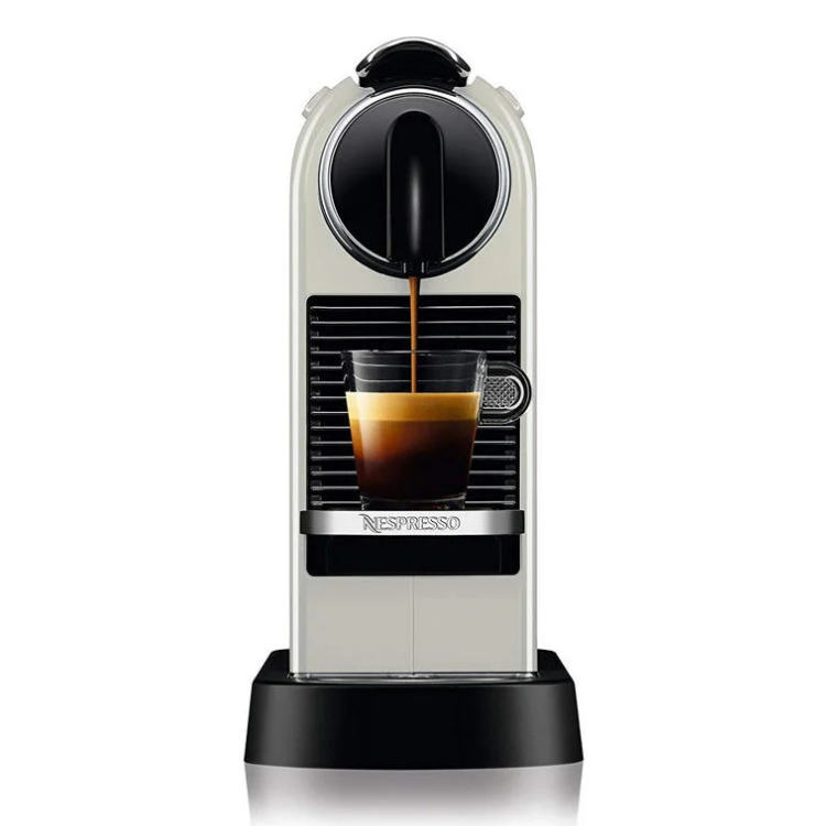 De'Longhi Nespresso Citiz white coffee machine dispensing espresso into a cup.