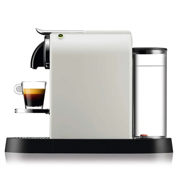 White Nespresso coffee machine with black base and silver accents, glass of coffee on tray, water tank on right. De'Longhi Citiz.