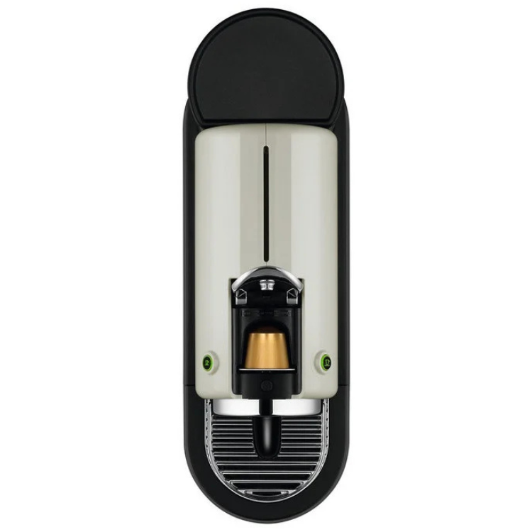 White and black DeLonghi Nespresso Citiz coffee machine, capsule slot and buttons visible.