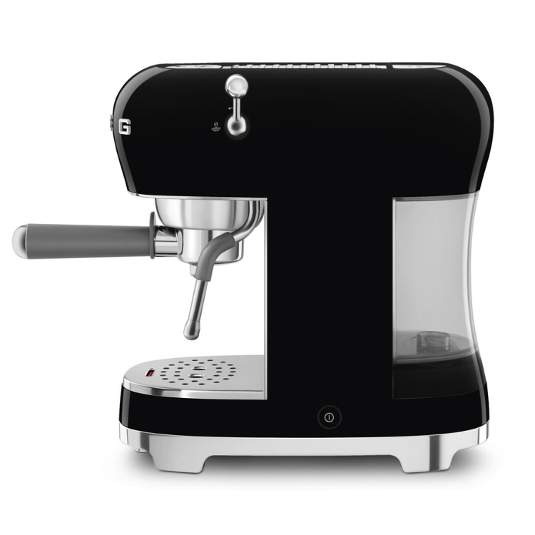 Black Smeg espresso machine with silver accents and clear water reservoir.