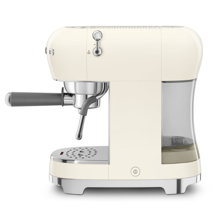 Smeg manual espresso machine, cream-colored, stainless steel accents.