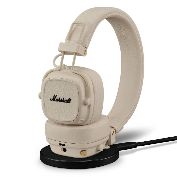 Marshall Major V cream headphones on black stand.