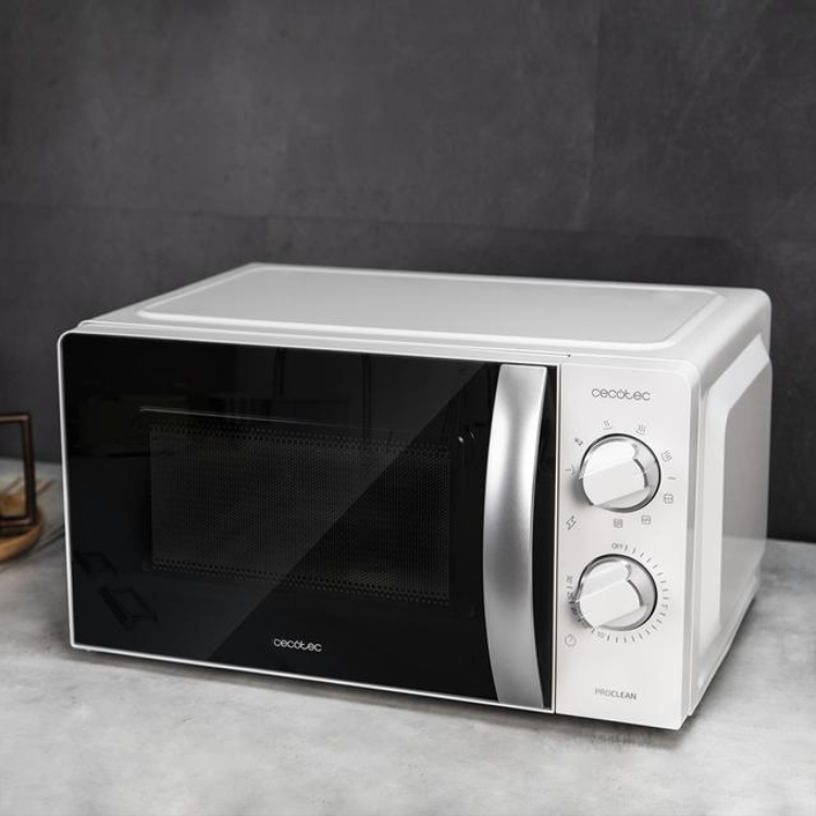 White Cecotec ProClean 2110 microwave with grill, 20L, 700W, on gray surface.