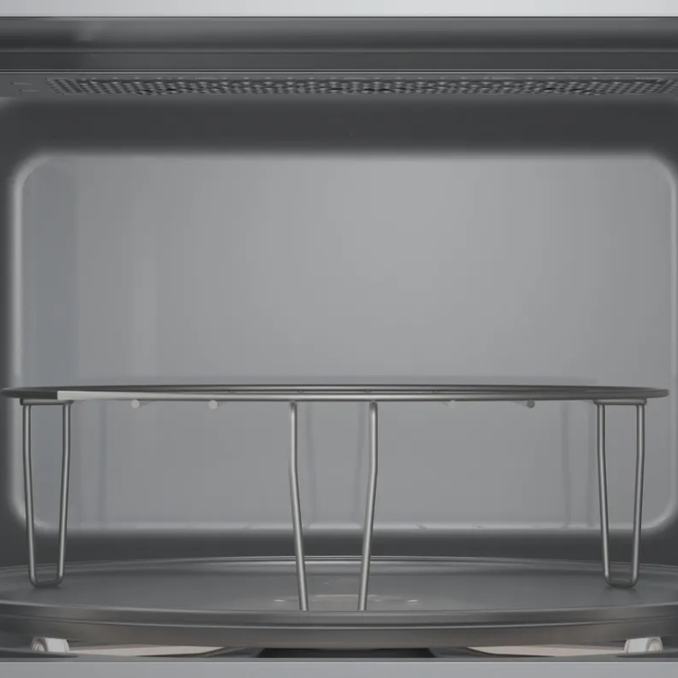 Bosch Serie 2 microwave interior, stainless steel, empty with turntable support.