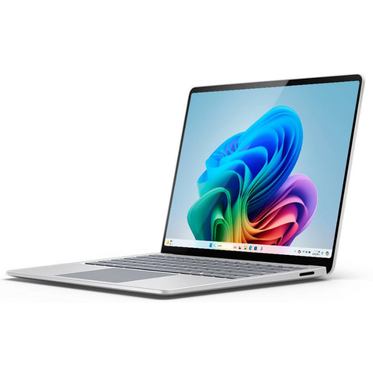 Silver Microsoft Surface Laptop with 13.8" screen, colorful wallpaper on display.