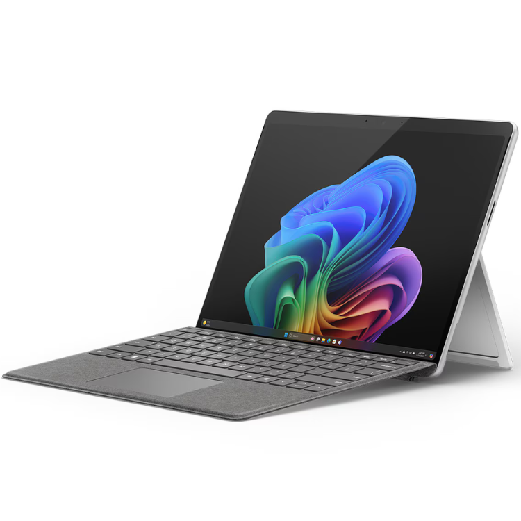 Microsoft Surface Pro 11, silver, 13" touchscreen, rainbow-colored wallpaper on screen.