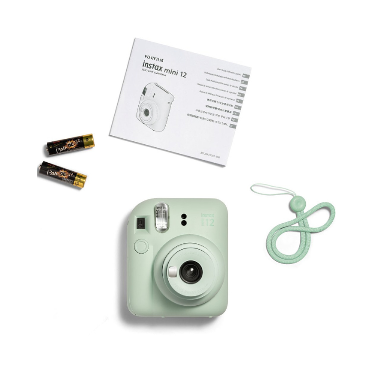 Fujifilm Instax Mini 12 green instant camera with manual, batteries and strap.