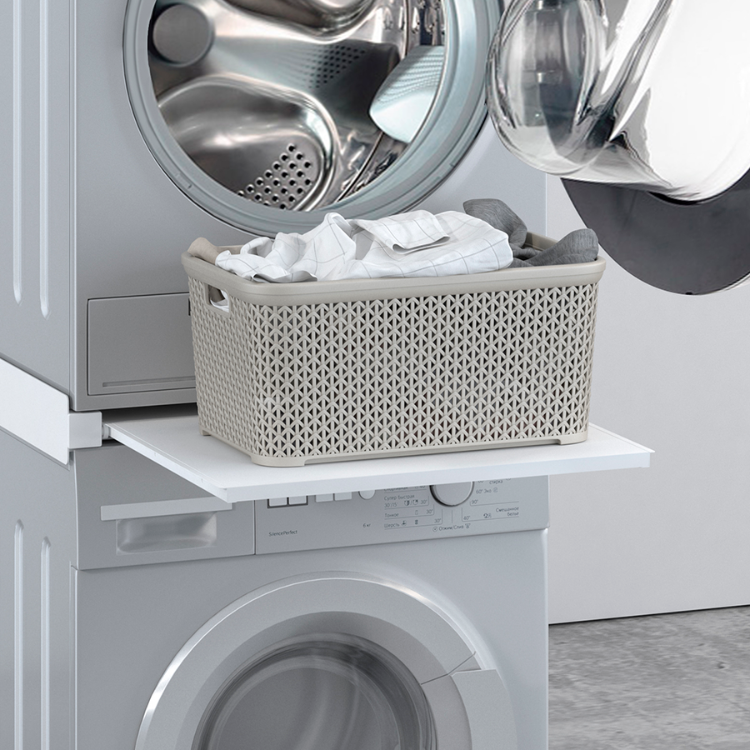 Gray laundry basket on white shelf above washing machine, with dryer on top. Napofix ML-3 vertical mounting base.