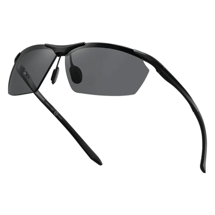 Black Xiaomi sport sunglasses with dark lenses, angled view.