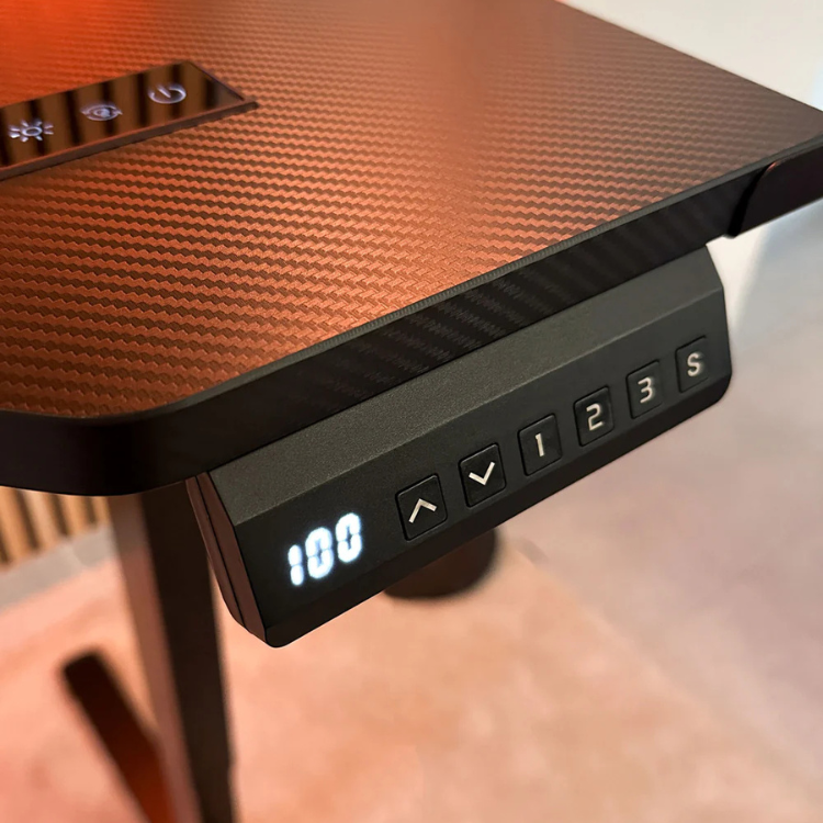 Electric standing desk control panel with buttons and LED display.